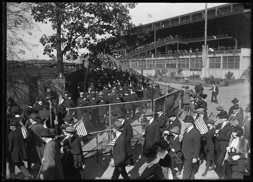 Crowd ascending ramp to stadium