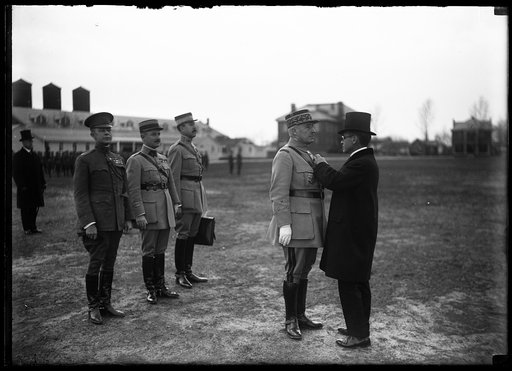 Newton Baker pinning a medal on Robert Nivelle
