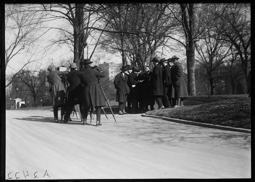 Photographers taking picture of group on grounds of White House, Washington, D.C.