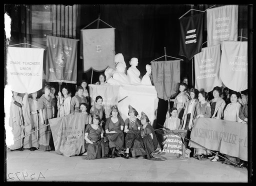 Women's groups with banners and sculpture: Portrait Monument to Lucretia Mott, Elizabeth Cady Stanton and Susan B. Anthony, U.S. Capitol, Washington, D.C.