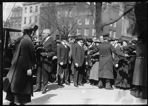 Warren and Florence Harding at automobile with crowd