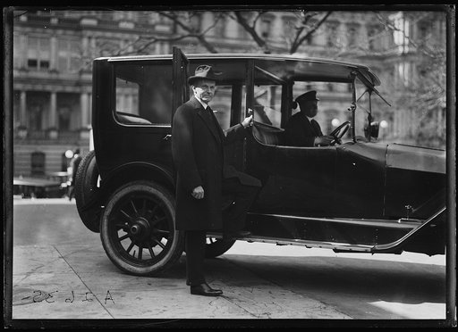Calvin Coolidge and car outside State, War, and Navy building, Washington, D.C.