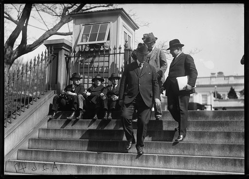 Edwin Denby and group descending steps. White House, Washington, D.C.
