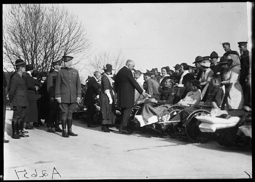 President and Mrs. Harding greet disabled men
