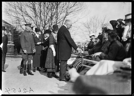 President and Mrs. Harding greet disabled men