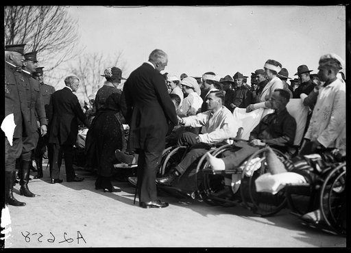 President and Mrs. Harding greet disabled men