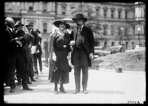 Albert Einstein with wife Elsa; State, War, and Navy building in background. Washington, D.C.