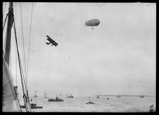 Boats, airplane, and blimp