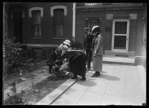Florence Harding bending over garden