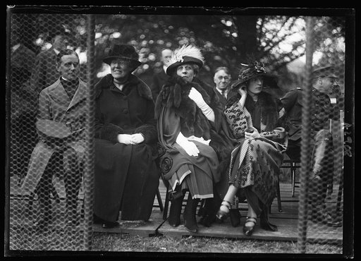 Mrs. Harding & [...] watching a game of tennis. Miss Laura Harlan, Mrs. Harding & Mrs. E.B. McLean