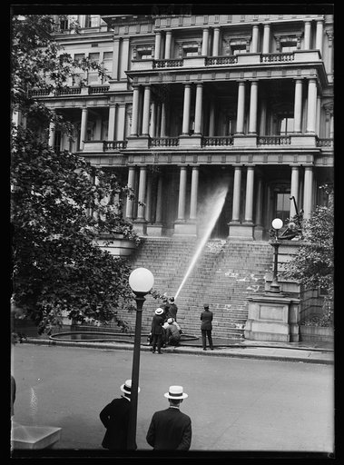 Water hose aimed at State, War, and Navy Building, Washington, D.C.
