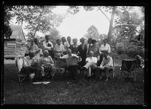 Henry Ford, Thomas Edison, Warren Harding, Harvy Firestone and group near cabin, Firestone camp