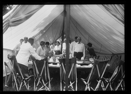 Thomas Edison, Warren Harding, and others] Dinner at Firestone camp