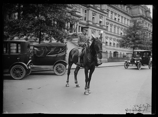 Charles E. Sawyer on horseback; State, War and Navy Building in background, Washington, D.C.