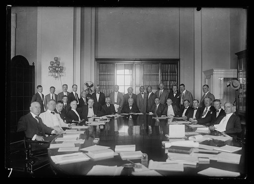 Group at table:includes Andrew W. Mellon, John W. Weeks, and John Nance Garner near head; and Nicholas Longworth, back row, left