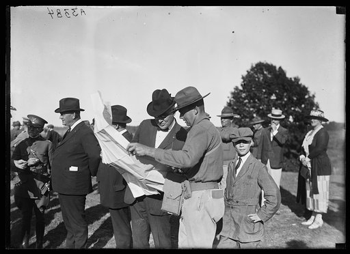 President Harding looking at a map during the Marine maneuvers at Wilderness Battlefield, Virginia, Oct. 1921