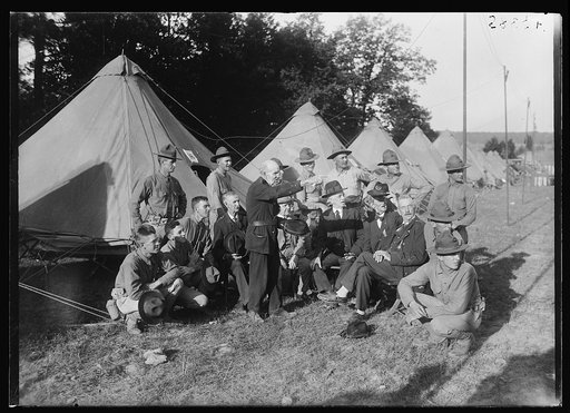 Old veteran points out to the Marines and his former buddies the scene of an incident of the Civil War in which he was a participant, during the Marine maneuvers at Wilderness Battlefield, Virginia, Oct. 1921