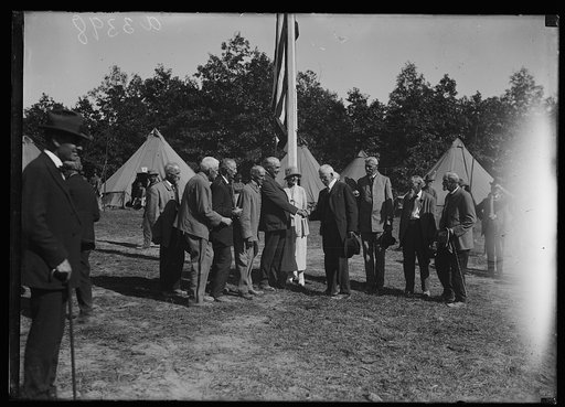 Mr. and Mrs. Harding with Civil War veterans during the Marine maneuvers at Wilderness Battlefield, Virginia, Oct. 1921
