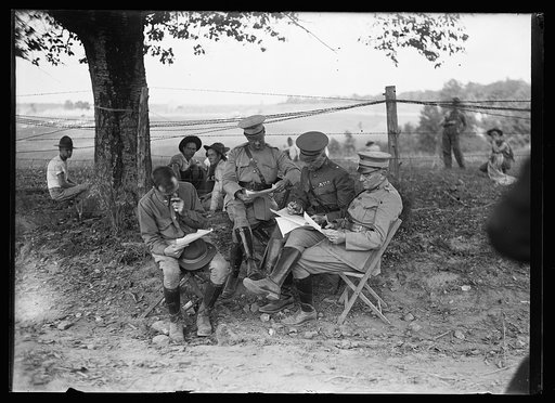 General John Lejeune, seated at right with others during Marine maneuvers at Wilderness Battlefield, Virginia, Oct. 1921
