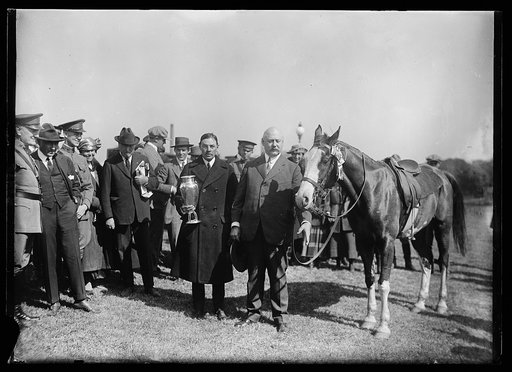 Man with Trophy and John W. Weeks next to horse
