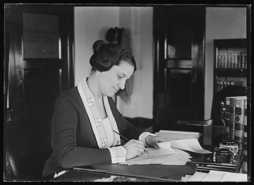 Mrs. Mabel W. Willebrandt at desk