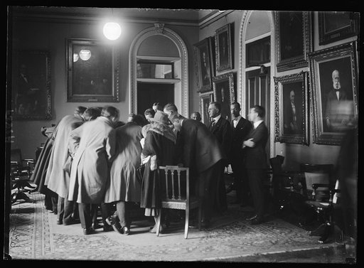 ...]r Treaty. Newspaper men around table