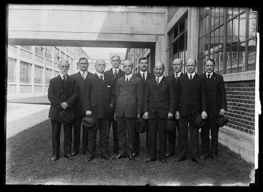 10 members of the Engraving Division of the Hydrographic office of the Navy Dept. Average yrs. of service is over 32. Chief J.A. Waddey has just completed 50 yrs. Front row: A.C. Ruebson, 36 yrs., J.A. Waddey, 50 yrs., R.A. Daniel, 33 yrs., Fred Ely, 29 yrs., C.W. Lehew, 24. Back row: C.G. Dougherty