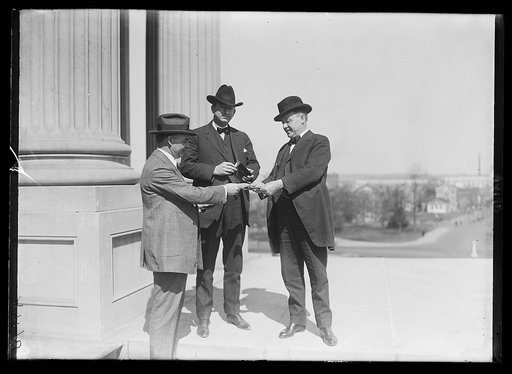 Sen. Pat Harrison & Sen. Fernold buying tickets from Secy. [...] to the opening game
