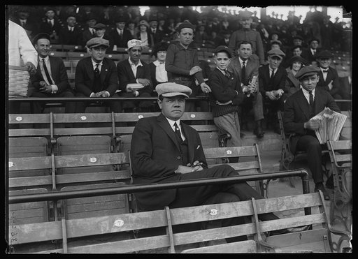 Baseball player Babe Ruth seated in the stands at baseball game, Washington, D.C.