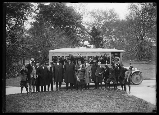 Edwin Denby and group of boys at bus