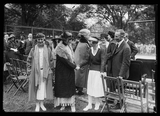 Tennis match at White House. Mrs. Harding shaking hands