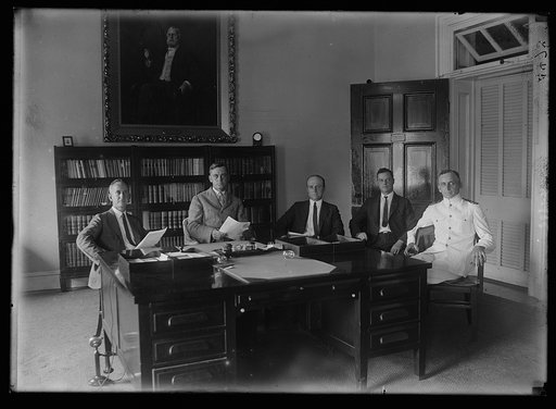 Col. Clifford and committee to determine cause of mysterious fire which broke out on a roof of Treasury the night of May 3. Left to right: H. Marks, Acting Chief Clerk; Col. Edward Clifford, Asst. Secy.; Jos. E. Murphy, Asst. Chief Secret Service; H.S. McAllister, inspector of bldgs.; and Capt. Q.B.