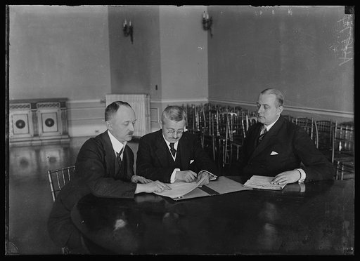 3 new German envoys to Wash. holding their first meeting at the German embassy. Left to right: Karl von Lewinski, Privy Counselor; Dr. Wilhelm Kiesselbach, Special Emissary of German govt. before the American German War Claims Commission; and Dr. Otto. Kiep, new Counselor of the Embassy