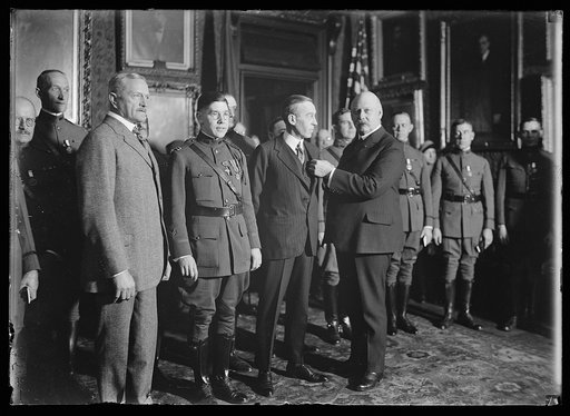 Group with John J. Pershing at left and John W. Weeks right front