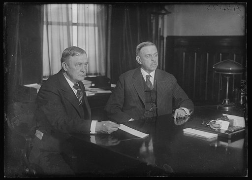 Secy. of Interior Hubert Work, Postmaster General Harry S. New at desk
