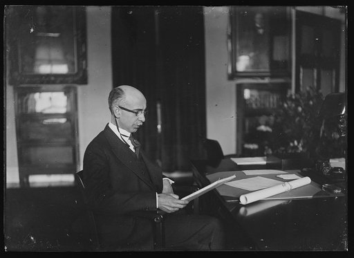 Henry M. Dawes at desk. Comptroller of Currency