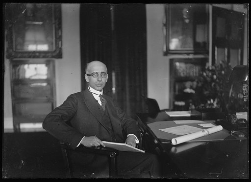 Henry M. Dawes at desk. Comptroller of Currency