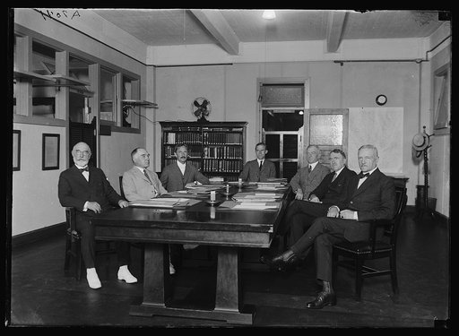 Group at table; John J. Pershing, right