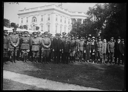 Calvin Coolidge and military group outside White House, Washington, D.C.