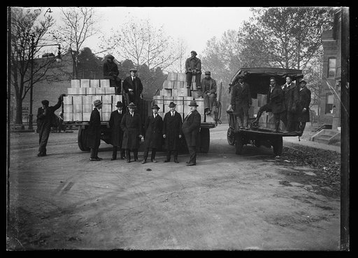 Group with boxes on trucks