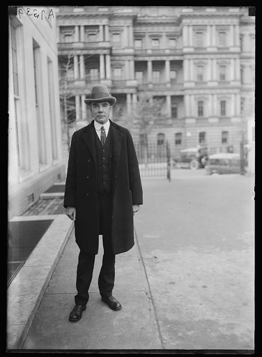 Man at White House; State, War and Navy Building in background. Washington, D.C.