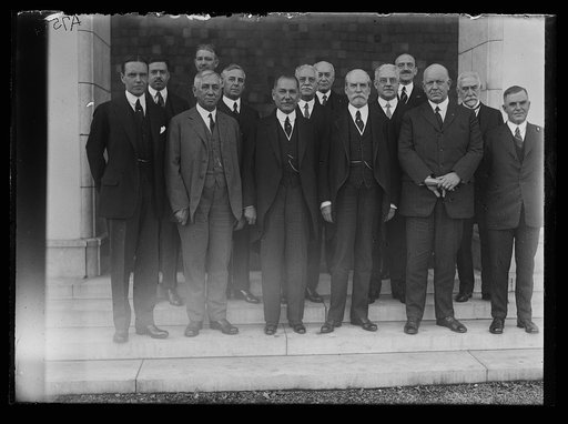 Group: includes Charles Evans Hughes, Edwin Denby, and Henry C. Wallace, front row, right