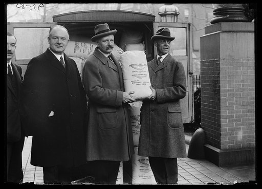 Men with bags: American Tree Seed, Douglas Fir [...] presented to Great Britain by Charles Lathrop Pack, President, American Tree Association, Washington, D.C.