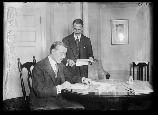 S. Yousry Pasha, seated, the 1st Egyptian Rep. Standing is A.M. Hassanein Bey, 1st Secy. to the Legation, who is well known on the continent as an explorer