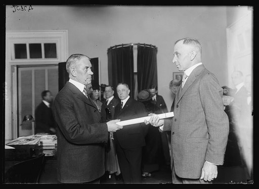 Judge Moss, right, giving Adm. Billard his commission as new Commandant of U.S. Coast Guard