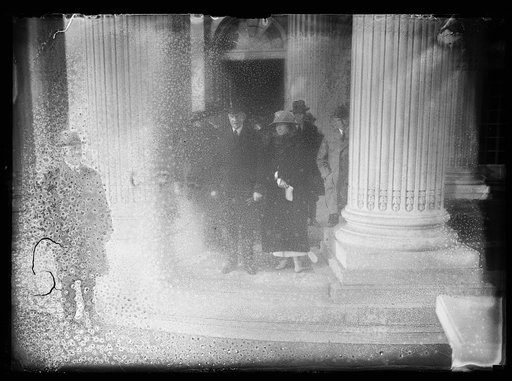Pres. and Mrs. Coolidge leaving memorial hall after attending annual budget meeting which he addressed