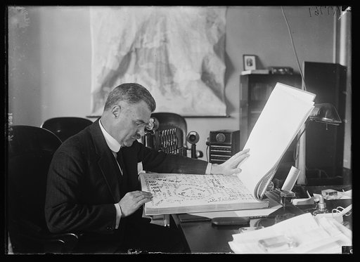 3rd Asst. Secy. of State J. Butler Wright with a huge body which contains more than 1/2 million signatures of Japanese citizens expressing their gratitude to the American people for aid rendered following recent earthquake and fire