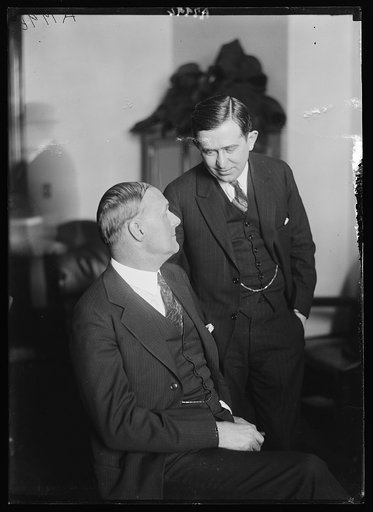 Tex Rickard, seated, famous fight promoter, with his attorney Hyman Bushel, at the Daugherty hearing