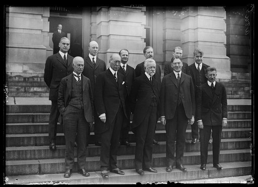 Secy. of Navy Curtis D. Wilbur was the guest of Senate Naval Affairs Committee luncheon. Left to right, front row: Senators O.E. Weller of Md., S.M. Shortridge of Calif., Henry C. Lodge of Mass., Secy. Wilbur, and Frederick Hale of Maine. Left to right, back row: George W. Pepper of Pa., Tasker L. O