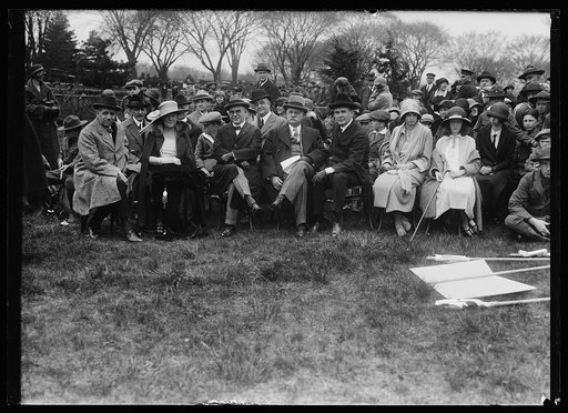 Group seated on lawn; Henry C. Wallace, front row